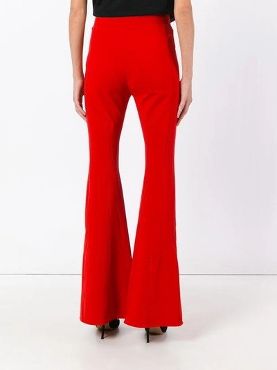 Shop Givenchy High Waist Flared Trousers In Red