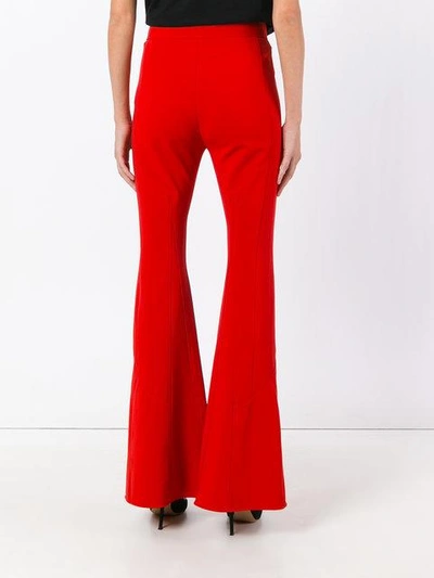 Givenchy Flared Crepe Trousers In Red