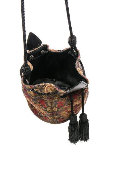 Shop Saint Laurent Anja Tapestry Bucket Bag In Brown. In Safran & Rouge