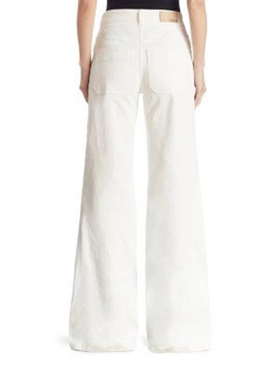 Shop Chloé Lace-up Denim Wide-leg Pants In White