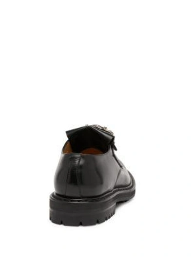 Shop Alexander Mcqueen Ornate Buckle Front Slip-on Shoes In Black