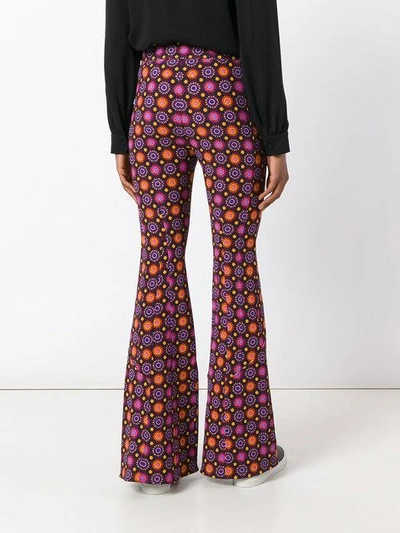 Shop Givenchy Psychedelic Print Flared Trousers - Pink
