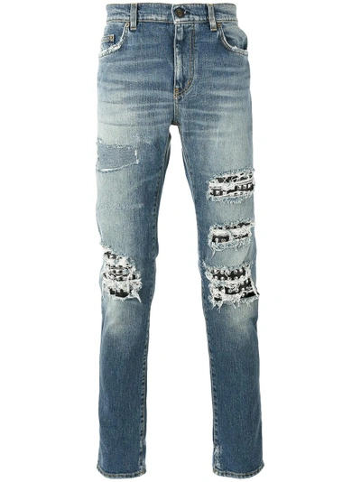 Shop Saint Laurent Studded Distressed Jeans