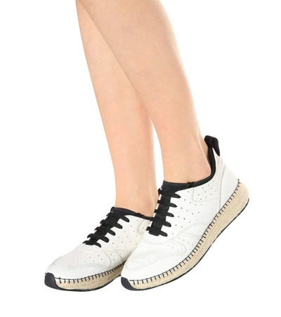 Shop Tod's Leather Sneakers In White