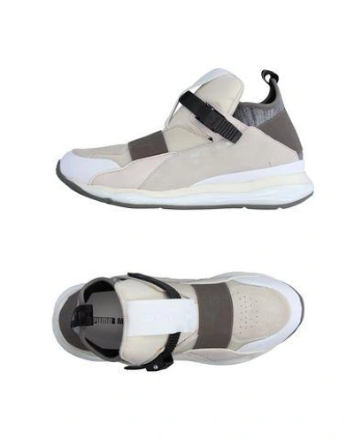 Shop Mcq Puma Sneakers In White
