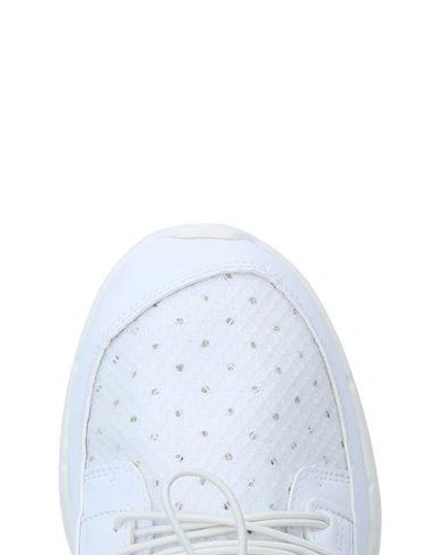 Shop Puma Sneakers In White