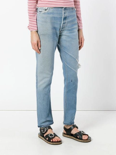 Shop Levi's Ripped Trim Jeans In Blue