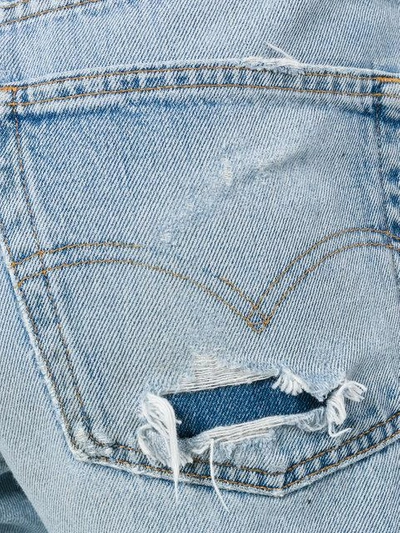 Shop Levi's Ripped Trim Jeans In Blue