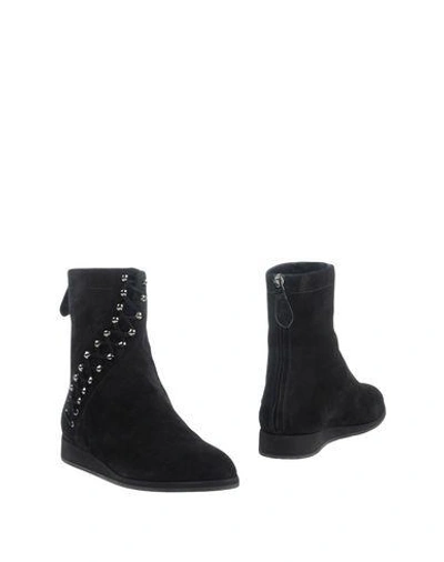 Shop Alaïa Ankle Boots In Black