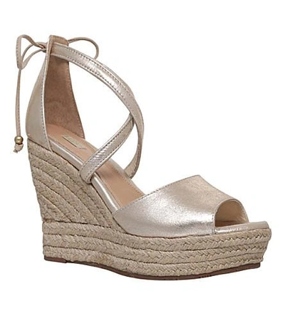 Shop Ugg Reagan Metallic-leather Wedge Sandals In Gold