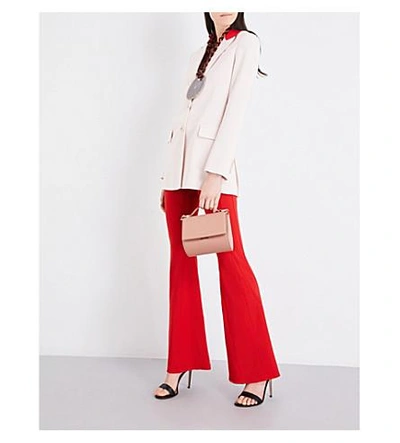 Shop Givenchy Flared Mid-rise Woven Trousers In Red