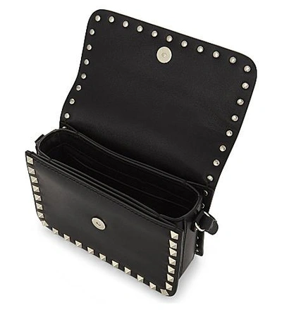 Shop Valentino Rockstud Leather Cross-body Bag In Black