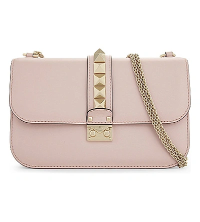 Shop Valentino Rockstud Leather Cross-body Bag In Water Rose