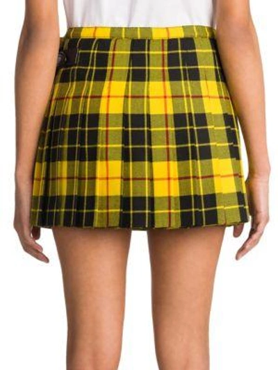 Shop Miu Miu Pleated Tartan Wool Patched Mini Skirt In Yellow Black