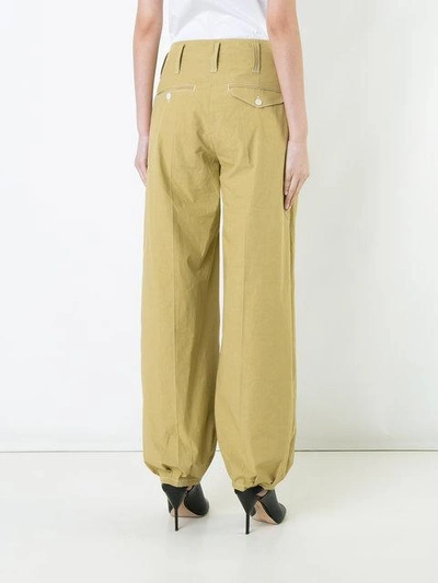 Shop Lemaire Flared Trousers In Yellow