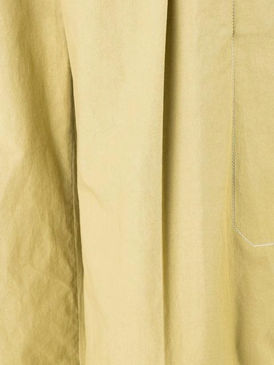 Shop Lemaire Flared Trousers In Yellow