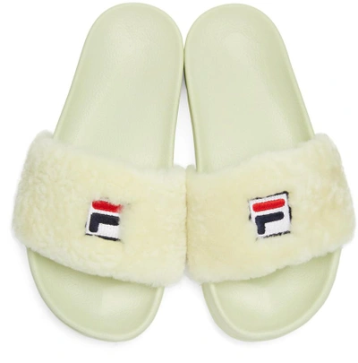 Shop Baja East Ivory Fila Edition Shearling Drifter Sandals
