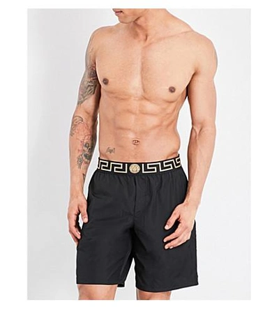 Shop Versace Iconic Long Swim Shorts In Black