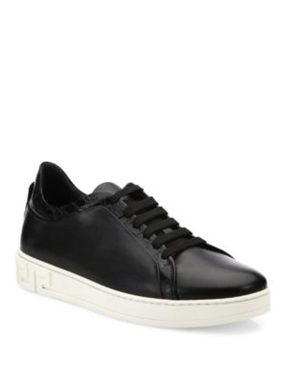 Shop Versace Grecca Leather Sneakers In Black