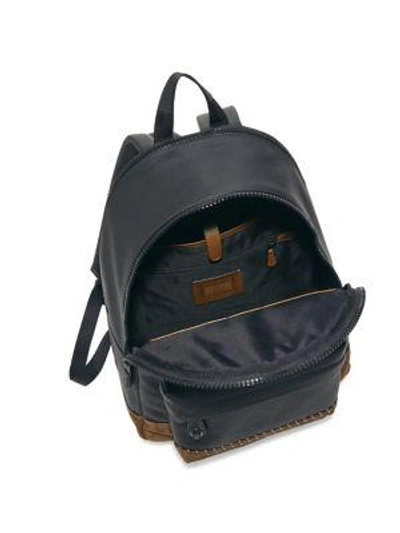 Shop Coach Rip Repair Polished Pebble Leather Backpack In Black Brown