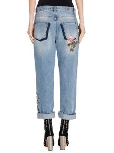 Shop Alexander Mcqueen Embellished Boyfriend Jeans In Faded Blue