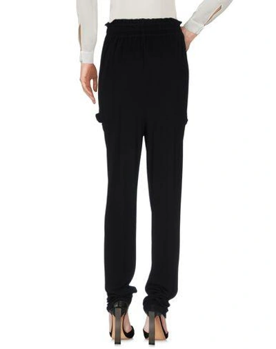 Shop Vionnet Casual Pants In Black