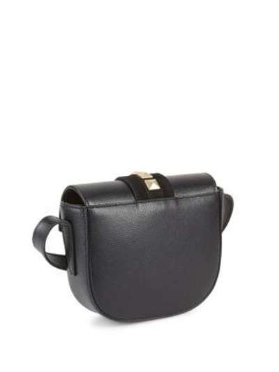 Shop Valentino Studded Leather Saddle Bag In Black