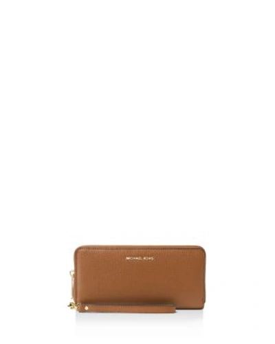 Shop Michael Michael Kors Mercer Travel Continental Wallet In Luggage/gold
