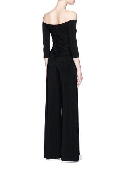 Shop Norma Kamali Ruched Off-shoulder Jumpsuit