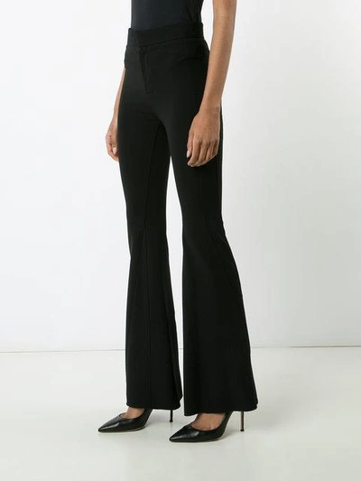 Shop Givenchy Flared Trousers - Black