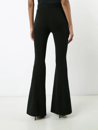 Shop Givenchy Flared Trousers - Black