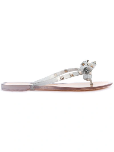 Shop Valentino Rockstud Bow Flip Flops In Metallic