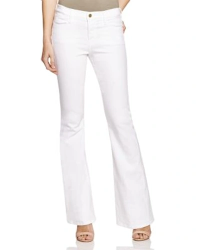Shop Frame Le High Flare Jeans In Blanc