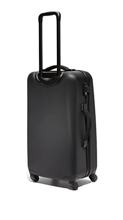 Shop Herschel Supply Co Trade Large Suitcase In Black
