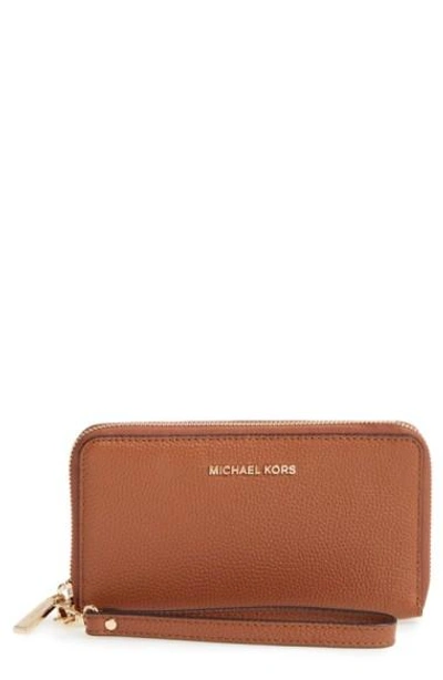 Shop Michael Michael Kors Mercer Large Leather Tech Wristlet In Luggage/ Gold