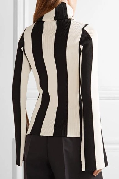 Shop Monse Striped Ribbed Stretch-knit Turtleneck Sweater In Black