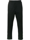 ALEXANDER MCQUEEN ZIP DETAILED SKULL PATCH TAPERED TROUSERS,464015QJX2312143610