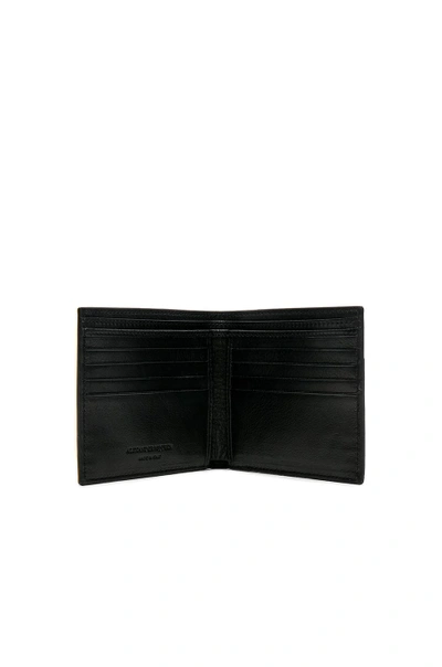 Shop Alexander Mcqueen Studded Billfold Wallet In Black