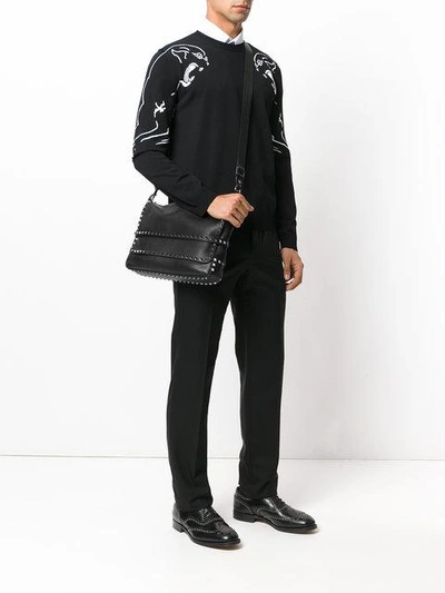 Shop Valentino Rockstud Messenger Bag In Black