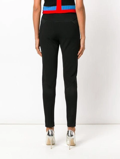 Shop Versace Paneled Zipped Cuff Trousers - Black