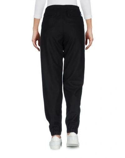 Shop Carhartt Casual Pants In Black