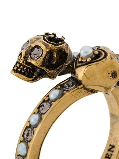 Shop Alexander Mcqueen Twin Skull Ring In Metallic