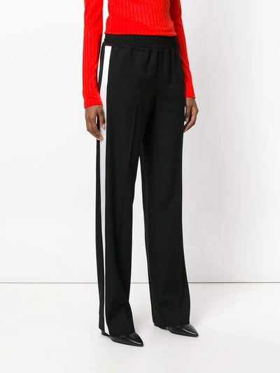 Shop Givenchy Contrast Stripe Trousers - Black