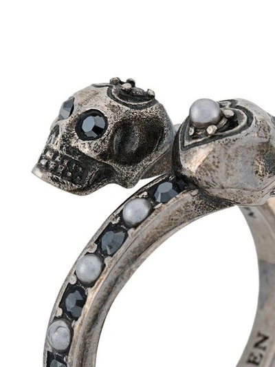 Shop Alexander Mcqueen Twin Skull Ring In Metallic