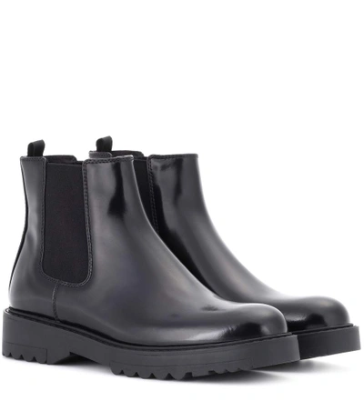 Prada Lug Sole Leather Chelsea Booties In Black