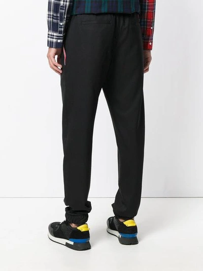 Shop Givenchy Stars And Stripe Panel Tapered Trousers