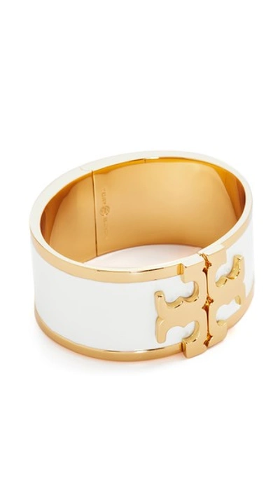 Shop Tory Burch Enamel Raised Logo Wide Cuff Bracelet In New Ivory/tory Gold