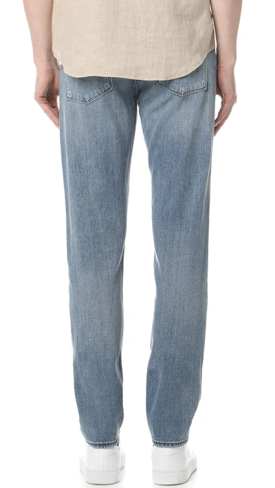 Shop J Brand Tyler Taper Jeans In Blue, White