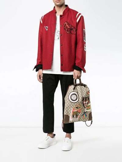 Shop Gucci Embroidered Badge Drawstring Backpack