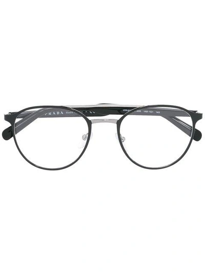 Shop Prada Round Frame Glasses In Black
